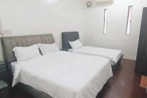 En eller flere senge i et værelse på Y.s.a Homestay(100mbps Wifi)