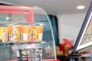 a display case in a store with some food at Skutan Inn Bangchak in Bangkok +58 photos