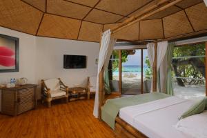 Uma cama ou camas num quarto em Safari Island