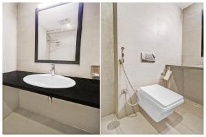 un bagno con lavandino, WC e specchio di Super Townhouse Lakdikapul a Hyderabad