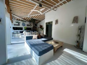 a living room with a couch and a table at Melati House in Uluwatu