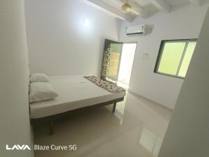 Ένα ή περισσότερα κρεβάτια σε δωμάτιο στο The Nest House Femily room