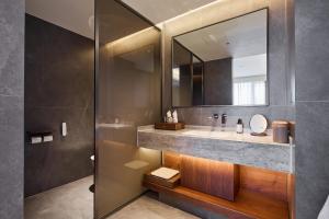 Koupelna v ubytování ARULA J Hotel