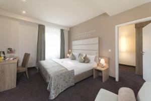 Postel nebo postele na pokoji v ubytování Best Western Hotel Lamm