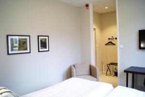 Postel nebo postele na pokoji v ubytování Hotel Falun