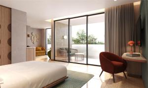 塞米亚克Kleo Seminyak, part of JdV by Hyatt的一间卧室，配有一张床、一张桌子和一把椅子