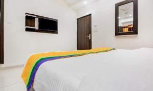 Itsy Hotels K K Residency Staywell客房内的一张或多张床位