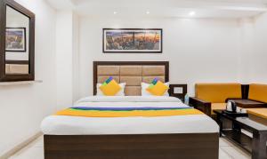 Itsy Hotels K K Residency Staywell客房内的一张或多张床位