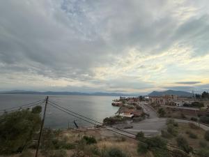 a view of a body of water with houses and buildings at Pension Remvi in Loutra Edipsou