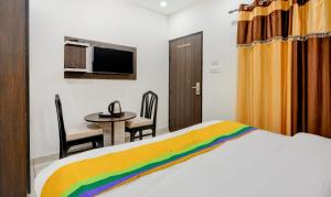 Itsy Hotels K K Residency Staywell客房内的一张或多张床位