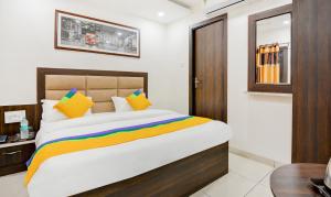 Itsy Hotels K K Residency Staywell客房内的一张或多张床位