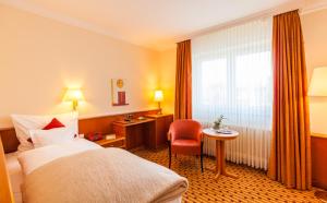 Postel nebo postele na pokoji v ubytování Hotel Friese