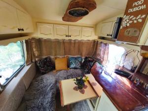 an interior view of a living room in an rv at Ekokemp Lipa in Štiavnické Bane