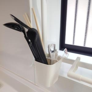 a white container filled with utensils on a counter at Chiba Gateway House in Chiba