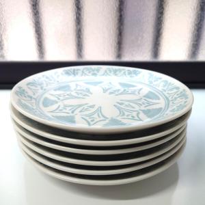 a stack of plates sitting on a table at Chiba Gateway House in Chiba