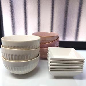 a group of bowls and plates sitting on a table at Chiba Gateway House in Chiba
