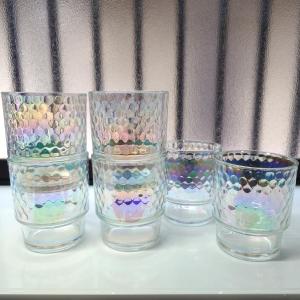 four glass cups with beads in them on a table at Chiba Gateway House in Chiba