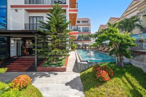 an image of a swimming pool at a resort at ELC Boutique Hoi An Hotel in Hoi An +49 photos