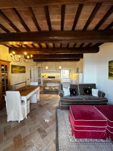 a living room with a couch and a table at Nido di Gufi in Todi