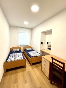 Postel nebo postele na pokoji v ubytování Hostel Vrba