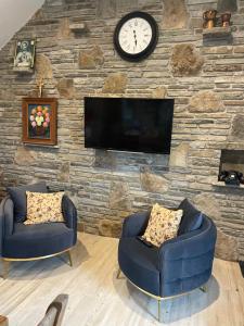 TV o dispositivi per l'intrattenimento presso Dun Aengus Cottage on the Cliffs of Moher