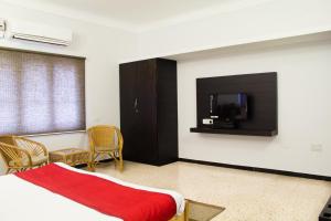 Un pat sau paturi într-o cameră la Corner Stay Serviced Apartment-Racecourse