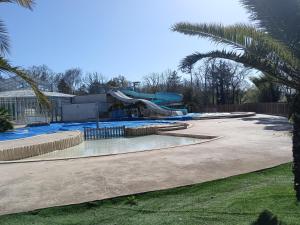 a pool with a water park with a slide at Paradis in Piriac-sur-Mer