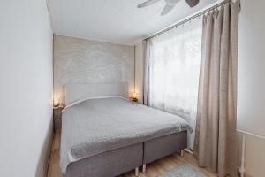 Postel nebo postele na pokoji v ubytování Kuuse 4 Apartment with 2 bedrooms