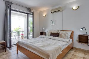 Postel nebo postele na pokoji v ubytování Guest House Jolanda