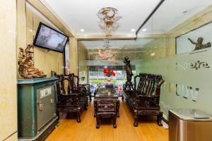 a room with chairs and a table in a store at Vuon Tao Dan Hotel - Trung Tâm Thành Phố Gần Chợ Bến Thành in Ho Chi Minh City