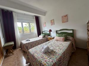 A bed or beds in a room at Villa Cancillo - 6802