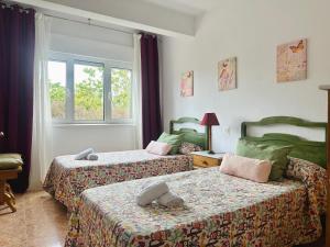 A bed or beds in a room at Villa Cancillo - 6802