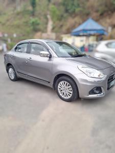 a silver car is parked on a road at Sedan cab car four wheel jeep in Pokhara