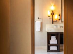 a bathroom with a sink and a counter with towels at Fairmont Chicago Millennium Park in Chicago