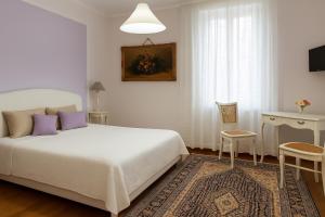 Postel nebo postele na pokoji v ubytování Miglioranzi Rooms
