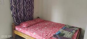 Letto o letti in una camera di His Grace Holiday Home - Nr to Malpe Beach