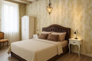 Postel nebo postele na pokoji v ubytování Miglioranzi Rooms