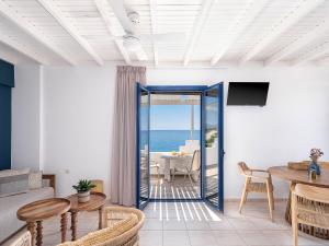 a living room with a view of the ocean at Anthos in Frangokastello