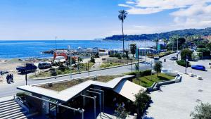 a view of a beach and the ocean from a building at Sotto la Torre a due passi dal mare in Varazze