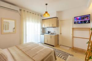 a small kitchen with a bed in a room at Villa Shafeti in Ksamil