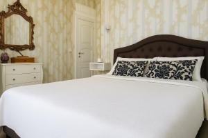 Postel nebo postele na pokoji v ubytování Miglioranzi Rooms