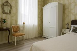 Postel nebo postele na pokoji v ubytování Miglioranzi Rooms