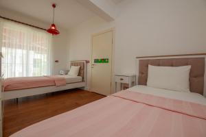 A bed or beds in a room at Villa Atlas