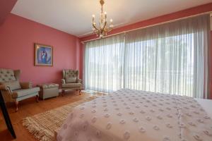 A bed or beds in a room at Villa Atlas