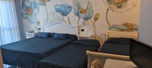 Postel nebo postele na pokoji v ubytování Hotel Confine