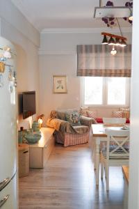 a living room with a couch and a table at Contessina Apt. in Corfu Town