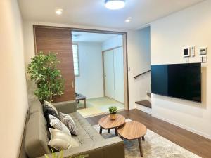 TV/trung tâm giải trí tại 新开业 四季别馆 天下茶屋 机场直达 温馨独栋别墅 三室二厅 二卫一浴