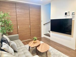TV/trung tâm giải trí tại 新开业 四季别馆 天下茶屋 机场直达 温馨独栋别墅 三室二厅 二卫一浴
