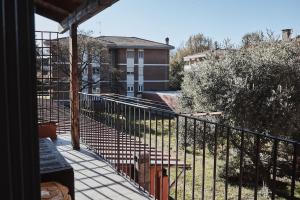 a balcony with a view of a building at Biella Room in Biella