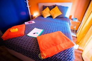 a bed with towels on top of it at l'Or dans la Mer Partner in Nice
